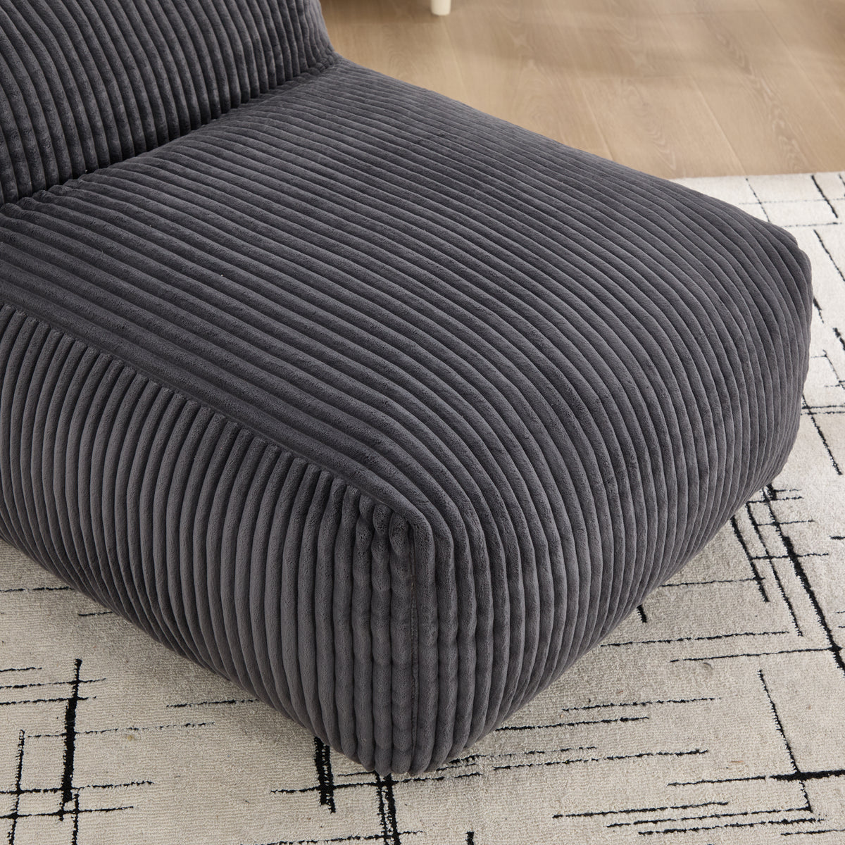 Floor-level view showing the wide-wale corduroy texture and generous depth