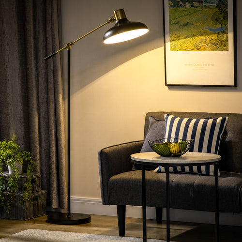 Black and gold adjustable floor lamp with balanced arm in a living room