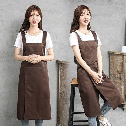 Two people wearing coffee brown cross-back kitchen aprons