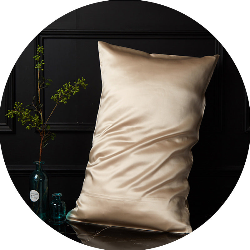 Close-up of champagne gold mulberry silk pillowcase showing fine silk texture