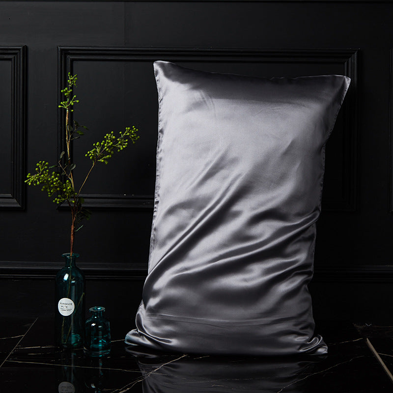 Metallic gray silk pillowcase showing the envelope closure and fine mulberry weave