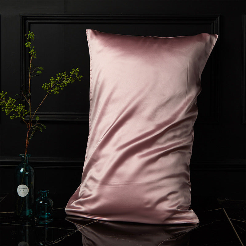 Dusty rose silk pillowcase showing the envelope closure and smooth mulberry silk